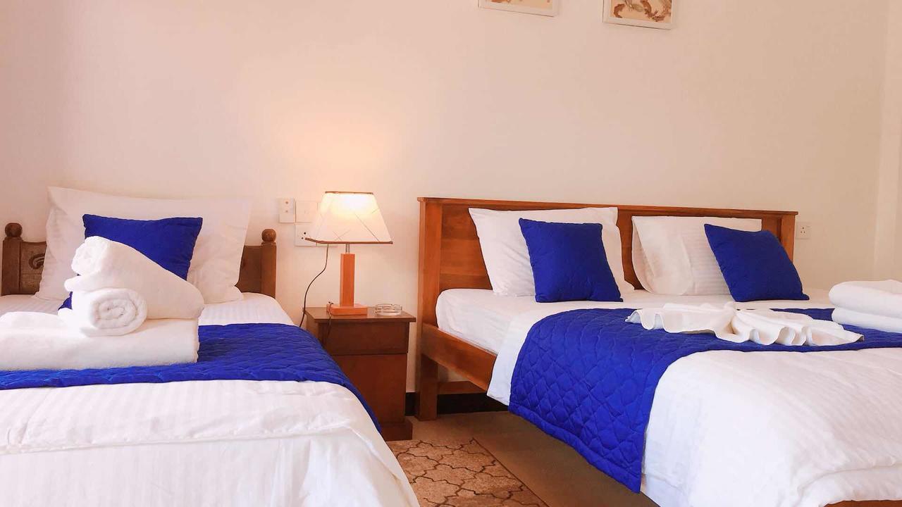 Blue Whale Holiday Hotel Мириса Екстериор снимка